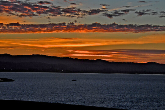 Colorful Sunset over San Francisco Bay with the Santa Cruz Mountains in background 