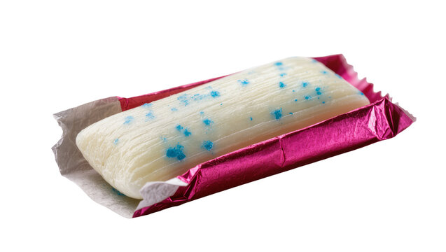 White chewing gum stick with blue specks in pink foil wrapper, isolated on transparent background