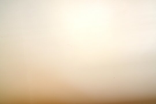 Smooth beige gradient background texture.