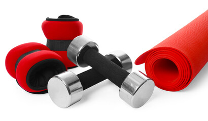 Dumbbells, ankle weights and fitness mat isolated on white