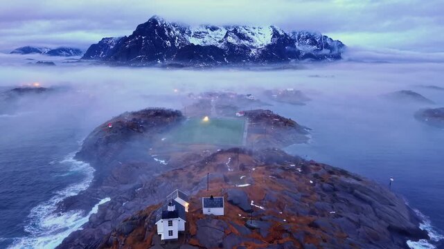 Landscape view of Henningsvaer village in Lofoten Norway with mountain in backgreoun.