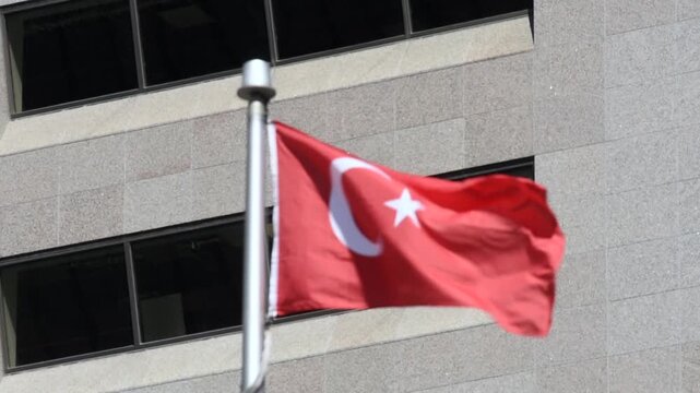 The Turkish flag on a flag pole at Toronto City Hall&rsquo;s Nathan Phillips Square.