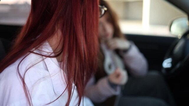 Young woman discreetly offers money to driving instructor inside car tense moment unethical proposal during lesson hidden corruption attempt for license without proper exam