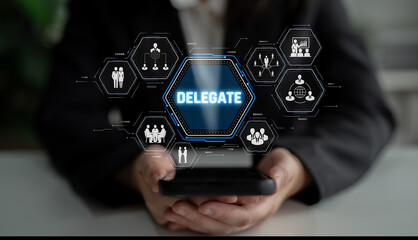 Naklejka premium Person Holding Smartphone with Delegate Concept Displayed on Screen, Showcasing Teamwork and Collaboration in Modern Business Environment Sigmoid