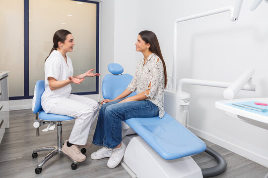 Dentist talks with patient about treatment options in a dental office