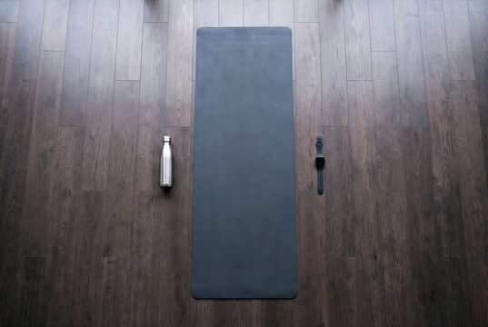 Yoga mat, water bottle, smartwatch ready for workout