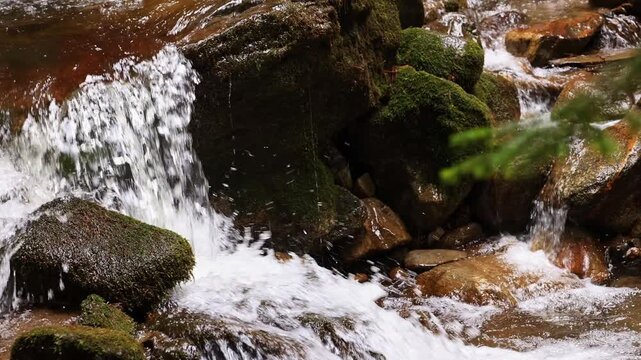Icy mountain waterfall in the forest.
