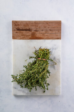 Bunch of thyme on white background, top view. Fresh herb