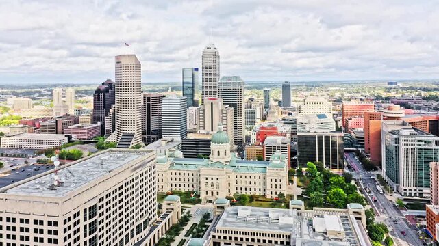 Aerial view of Indianapolis, Indiana with forward rotation towards the skyline and the State Capitol.