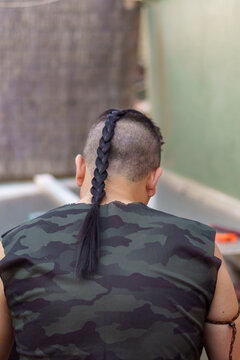 Rear view of person with braided ponytail