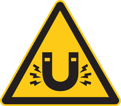 Magnetic Warning Sign: A prominent yellow warning sign displaying a horseshoe magnet within a black triangle, cautioning about magnetic fields and potential hazards.