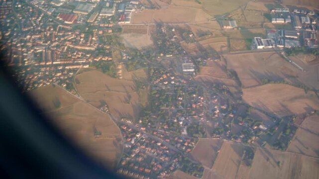 Madrid suburbs slowly drifting away seen from
airplane window