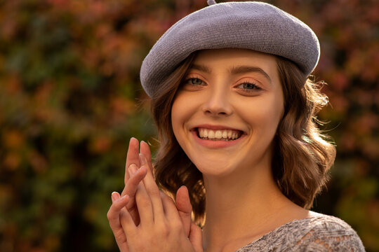 Beautiful young woman with clean perfect  skin and curly hair. Woman portrait of beauty model girl with natural makeup. Autumn seasonal woman girl portrait. Selective focus