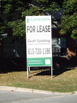 Nepean, Ontario, Canada &ndash; July 27, 2025: A Capworth commercial real estate "For Lease" sign for Geoff Godding stands on Antares Drive.
