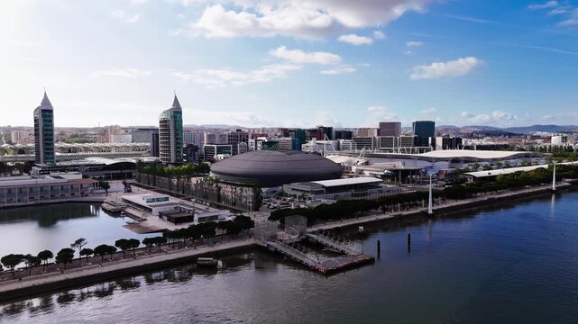 Aerial view of Altice Arena and Vasco da Gama Tower in Parque das Nacoes on a cloudy day. Lisbon, Portugal