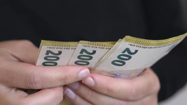 Money exchange concept highlights cost of living and financial decisions. Euro banknotes used in everyday transactions and economic analysis. Close view of euro banknotes represents consumer spending 