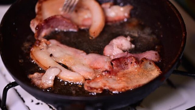 Man making bacon sandwich, close up, home cooking, home made food, shadow depth of felt selective focus real time video