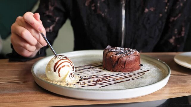 Delicious chocolate fondant dessert with ice cream.