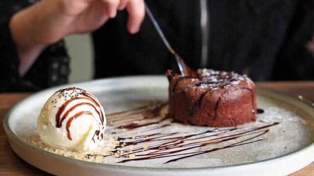 Delicious chocolate fondant dessert with ice cream.