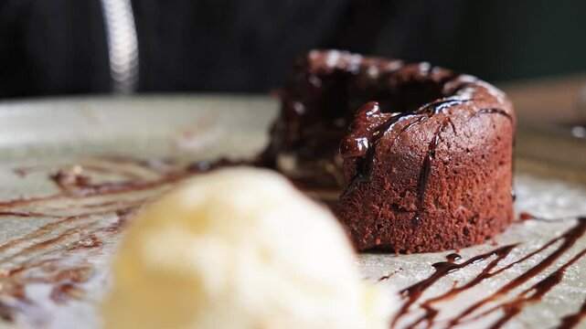 Delicious chocolate fondant dessert with ice cream.