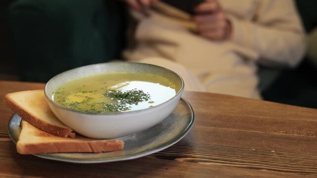 A bowl of fresh noodle soup at a cafe.