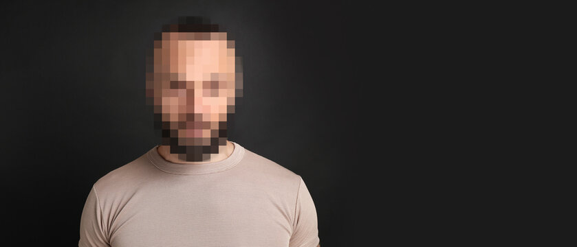 Anonymous man with pixelated face on dark grey background