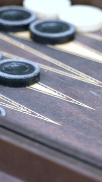 Playing Backgammon in Vertical Format &ndash; Dice Rolling and Hands Close-Up 4K