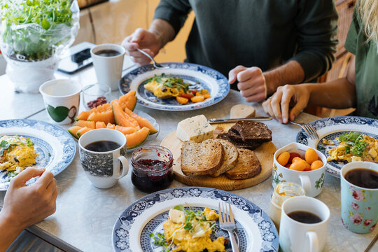 Crop family having breakfast together