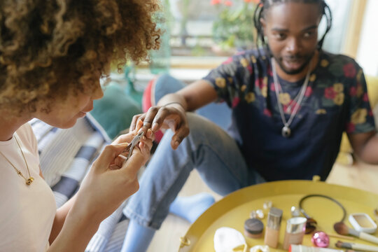 Female Afro Woman doing Manicure