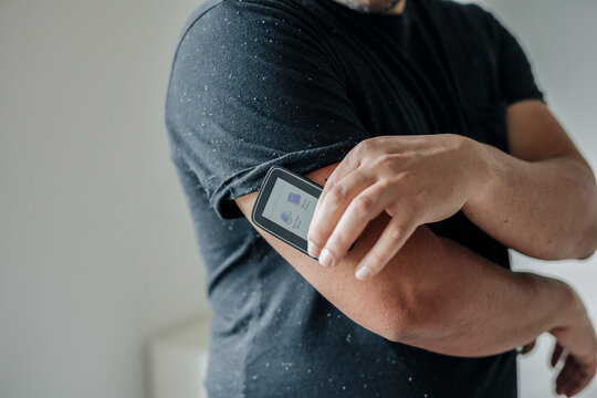 Diabetic measuring sugar levels. 