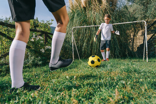 Two soccer players train on the sports field