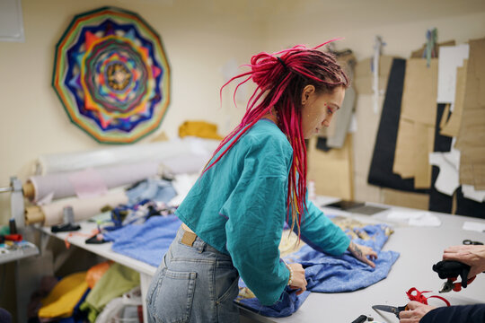 chaos at studio of recycling clothing