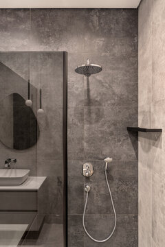 Bathroom in contemporary style with tiled walls
