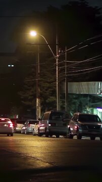 Busy Urban Intersection at Night with Fast Moving Traffic in Paraguay - Vertical Video 4K