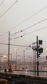 Woman with Umbrella Walking on Rainy Platform at Roma Termini Station - Vertical Video 4K
