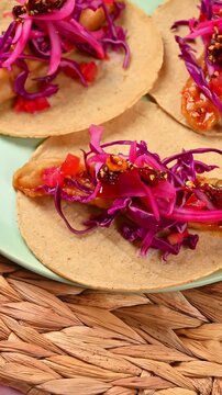 Close-up of an Ensenada-style fish taco with artisanal macha sauce