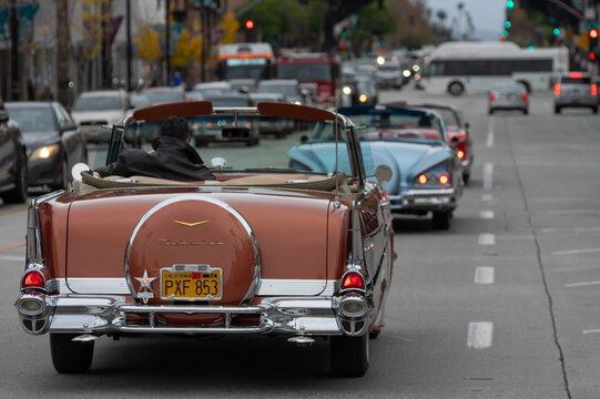 Classic Chevrolet and a mix of vintage and modern cars cruising along Colorado Boulevard on New Year&rsquo;s Eve in Pasadena, California, December 31st, 2023.