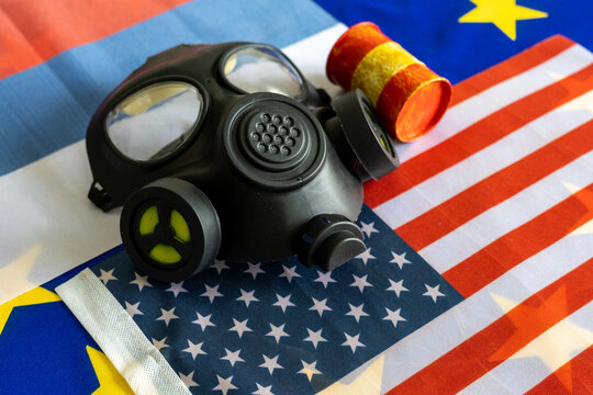 Nuclear Waste Barrels and Gas Mask on Tri-National Flags