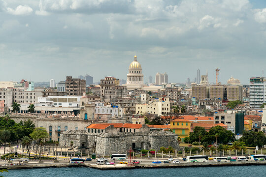 Cuba, Havana.  View of downtown Havana from the Castillo del Morro.  The Capital Building is prominent in the background.