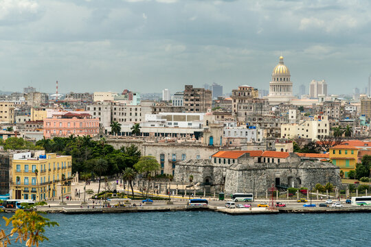 Cuba, Havana.  View of downtown Havana from the Castillo del Morro.  The Capital Building is prominent in the background.