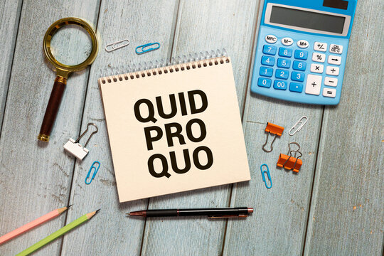 Quid pro quo - words from wooden blocks with letters,