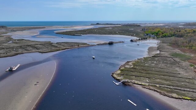 Abandoned railroad bridge over North River near mouth to the Atlantic Ocean aerial view between town of Scituate and Marshfield, Massachusetts MA, USA. 