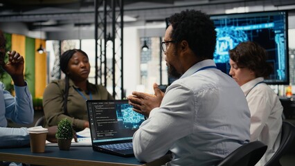 System administrators working in AI startup training predictive models for language processing tasks. Machine learning tech experts use technical expertise for complex IT requirements, camera A © DC Studio