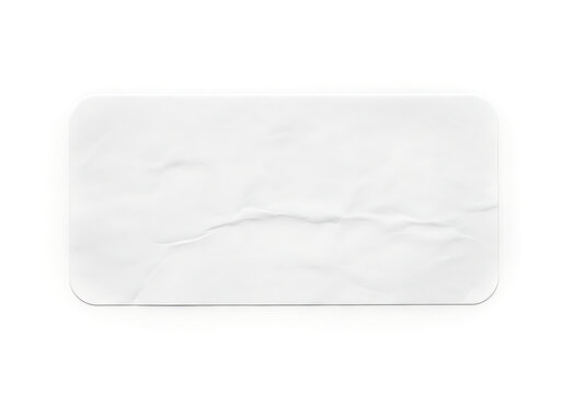 Crumpled blank white paper label on white background