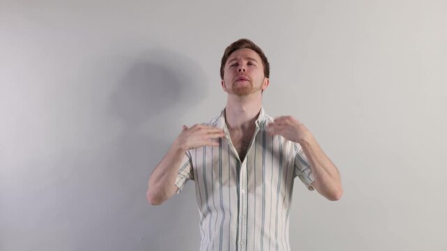Man suffering from sweating on light background