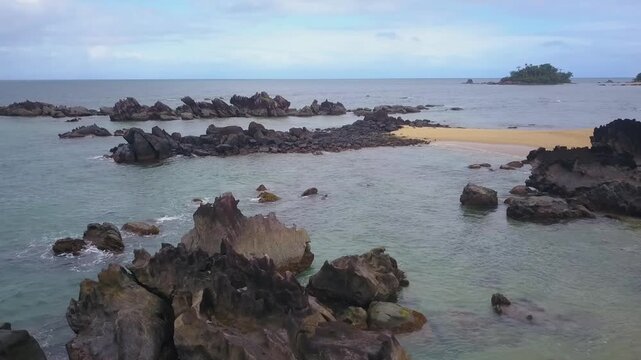 Summer morning at rocky beach. Video with beautiful morning view of the Indian ocean from Madagascar island.