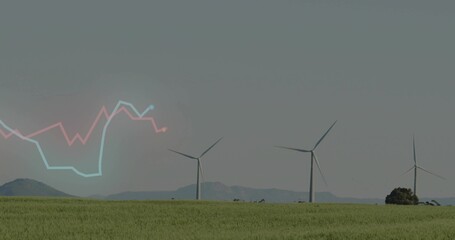 Fototapeta premium Showing three white wind turbines turning over rural wind farm, with distant hills, shrub, graph