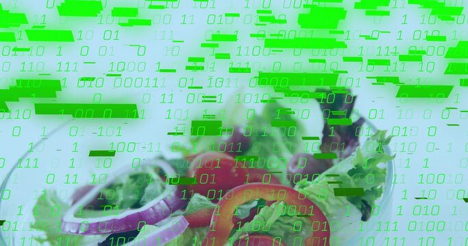 Showing shallow salad bowl on table, greens, onion rings, tomato, olives with green binary overlay