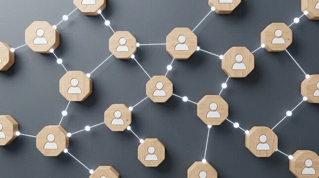 Large scale network of wooden user icons linked by glowing lines on dark gray wall representing enterprise workforce and departmental connections