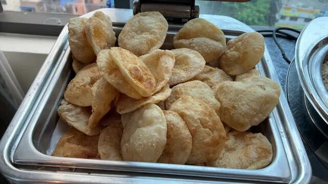 Fresh puri served in an Indian wedding